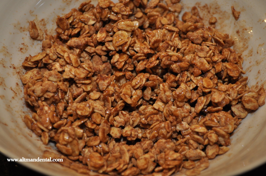 granola mixed with maple syrup