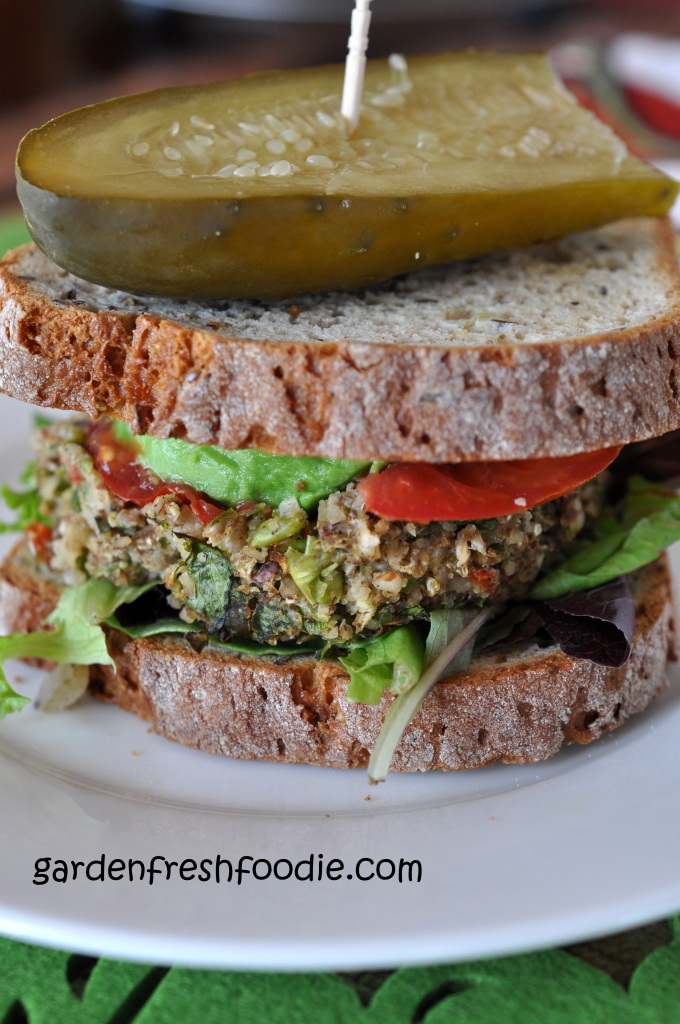 Cauliflower Veggie Burger Topped With Avocado, Tomato, Lettuce, and A Garlicky Dill Pickle