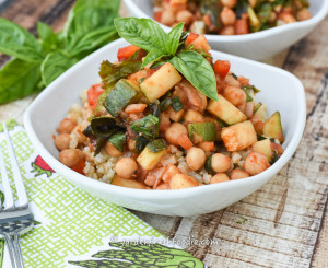 Bowl of Saucy Chickpeas WIth Zucchini and Fresh Greens and Basil