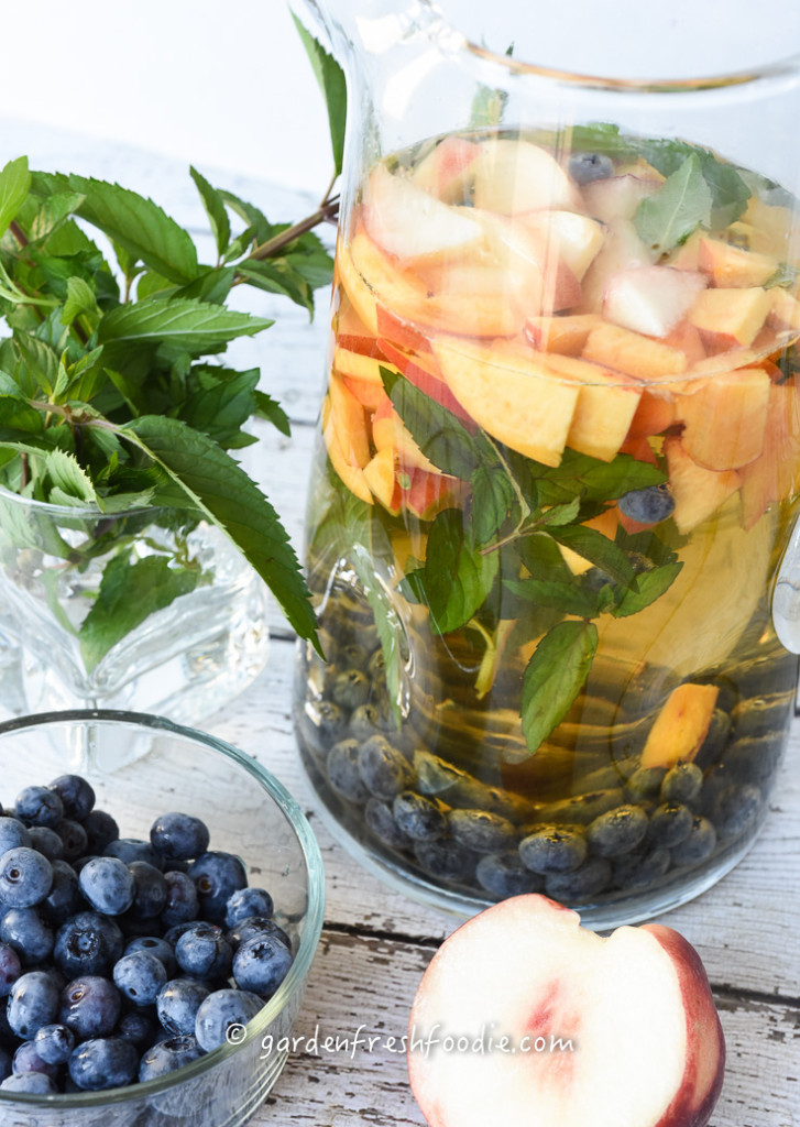 Mixing Up White Wine Sangria With Fresh Peaches, Mint, and Blueb