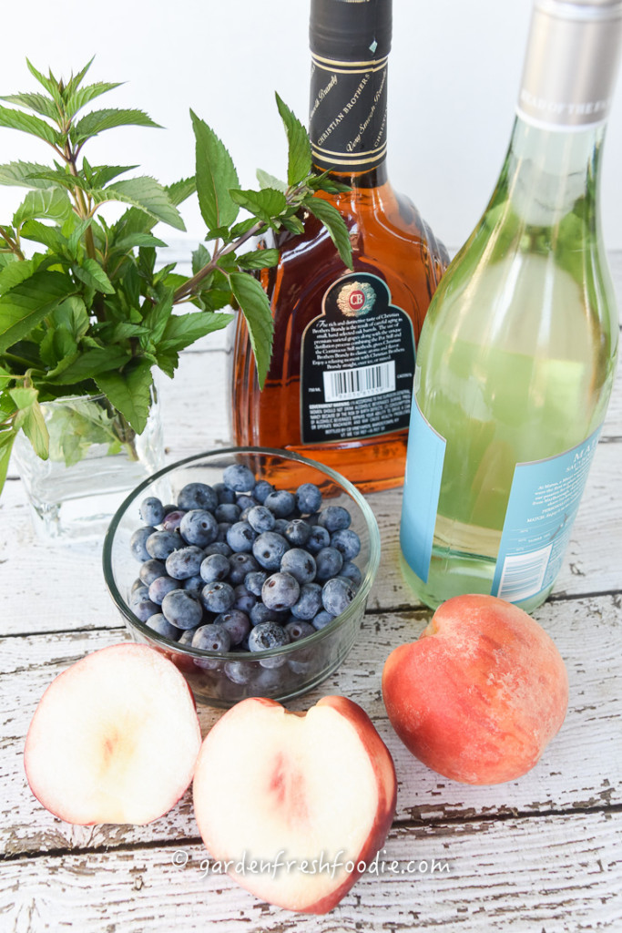 White Wine Sangria With Fresh Peaches, Mint, and Blueberries Mise En Place